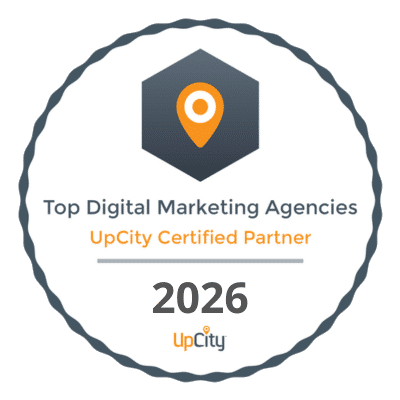 A circular badge with a location pin icon and text reading "Top Digital Marketing Agencies, UpCity Certified Partner, 2026." The UpCity logo appears at the bottom.